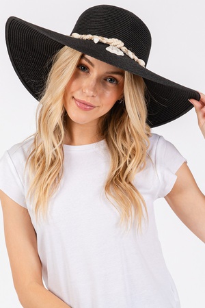 WIDE BRIM STRAW SUN HAT WITH SHELL AND CONCH BRAIDED BAND.